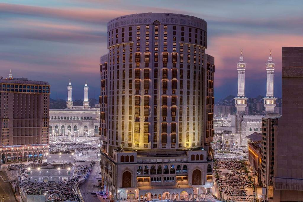 a large building in a city at night at Makkah Hotel in Mecca