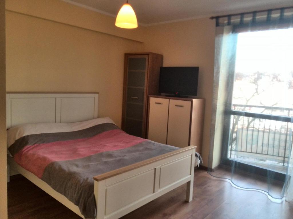 Posteľ alebo postele v izbe v ubytovaní Mikołajki Apartamenty Rynek