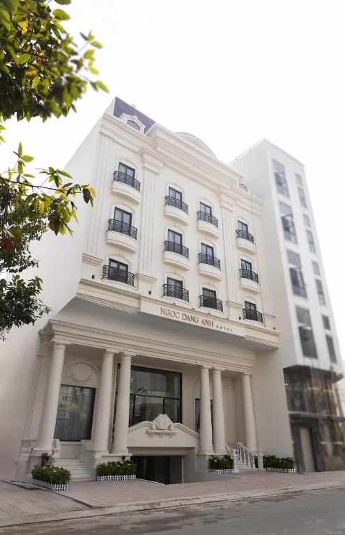 a white building with a sign on the front of it at Ngoc Dang Anh Hotel in Nhơn Trạch