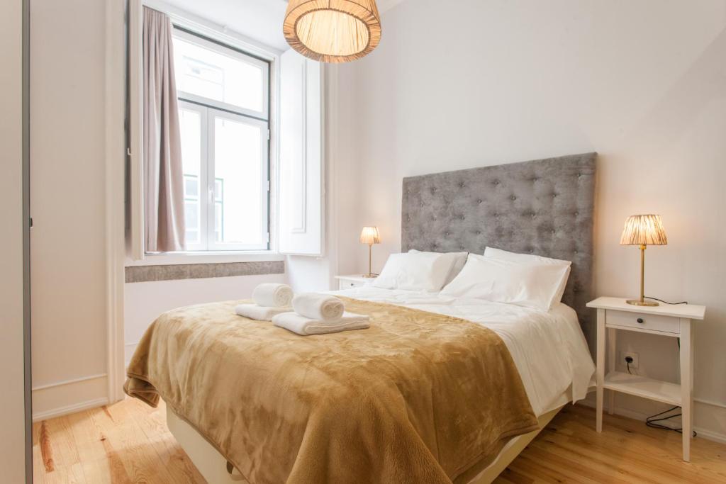Кровать или кровати в номере Lisbon Center Apartments