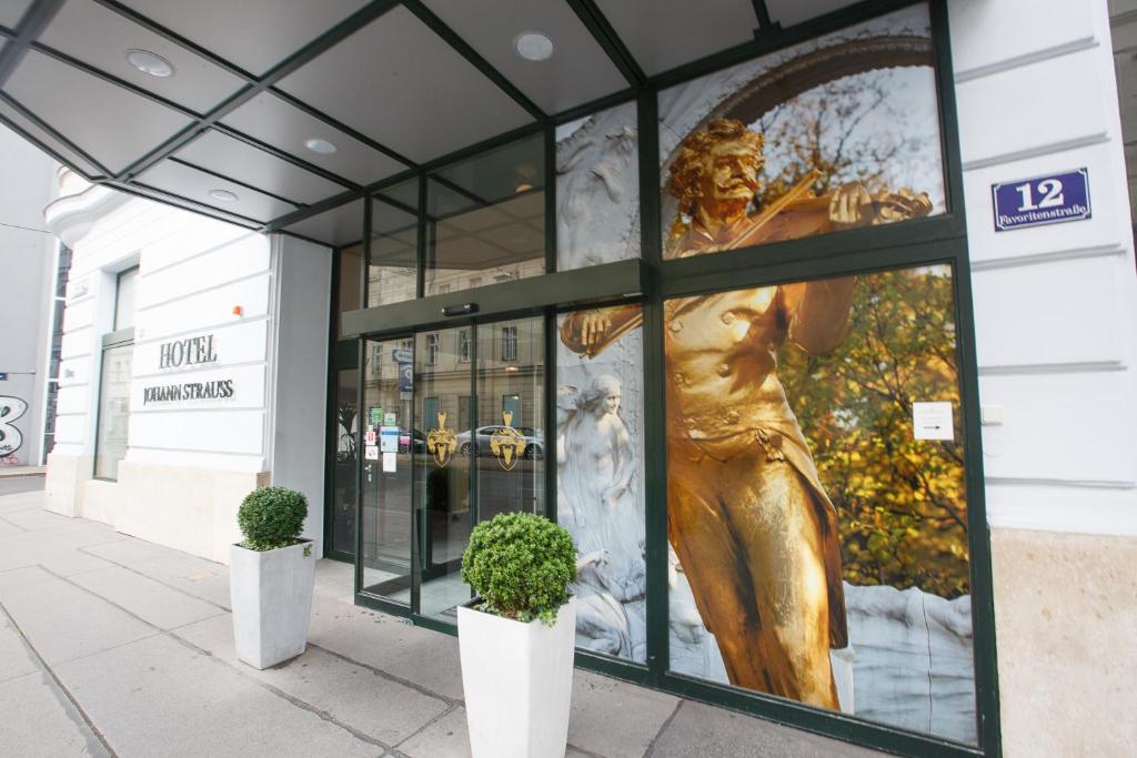 a statue of a woman in a window of a store at Hotel Johann Strauss in Vienna