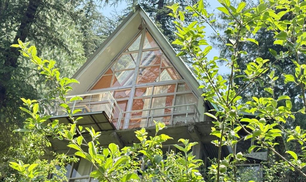 a tree house in the middle of some trees at jibhihomesteadcabin in Jibhi