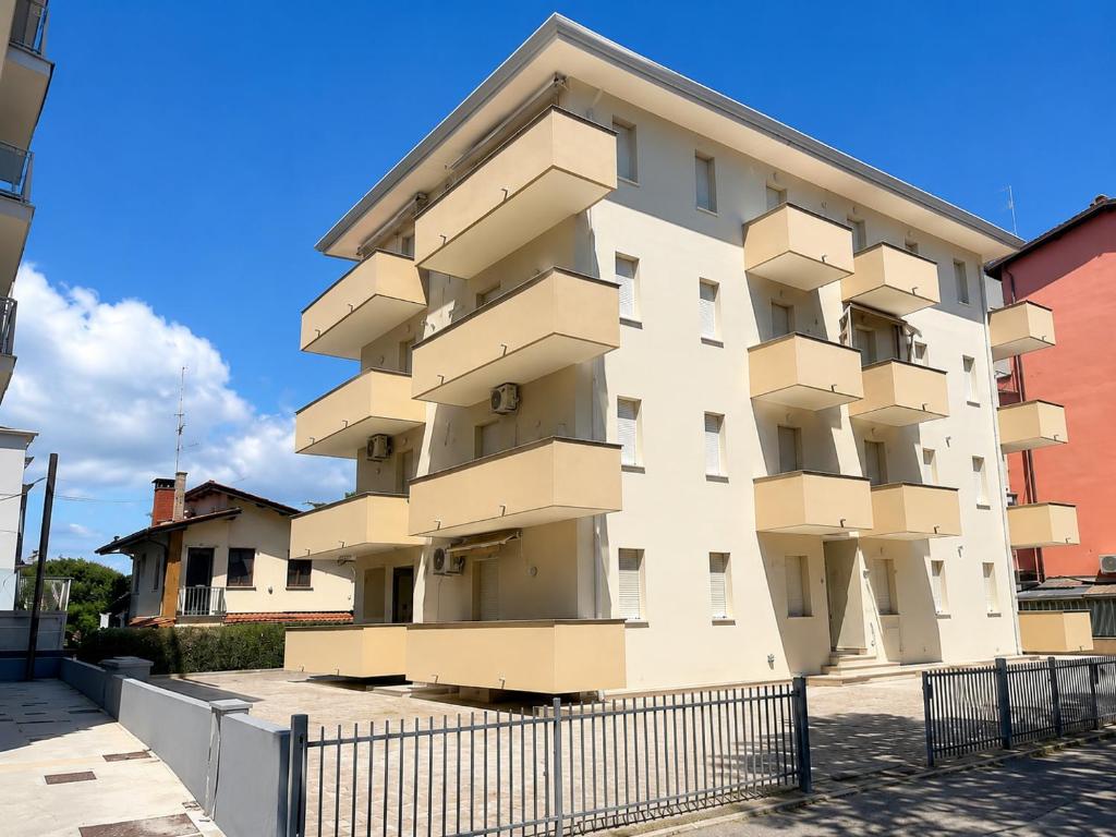 a building with boxes on the side of it at Condominio Cristina - Agenzia Cocal in Caorle