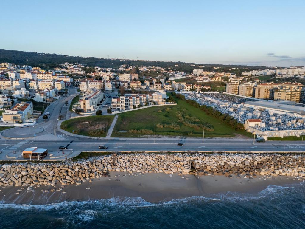 an aerial view of a beach and buildings at Praça da Cultura Residence in Buarcos