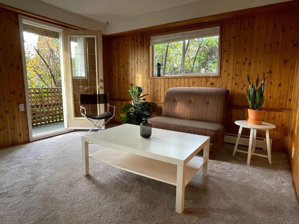 a living room with a couch and a coffee table at 2-Bedroom Suite in North Vancouver