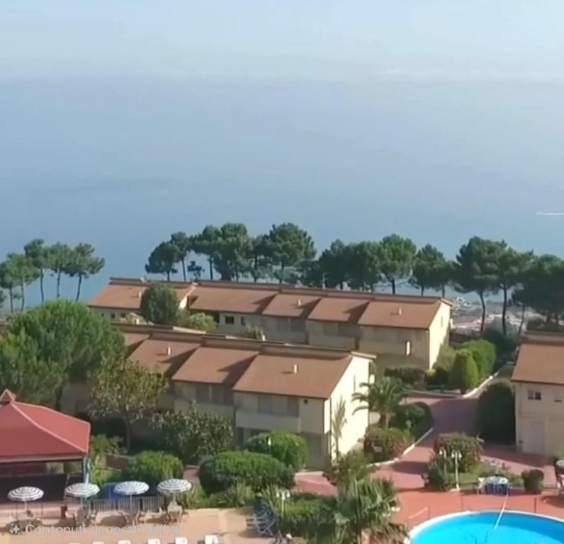 an aerial view of a resort with a pool at Appartamenti Bellavista Club Tropea in Tropea