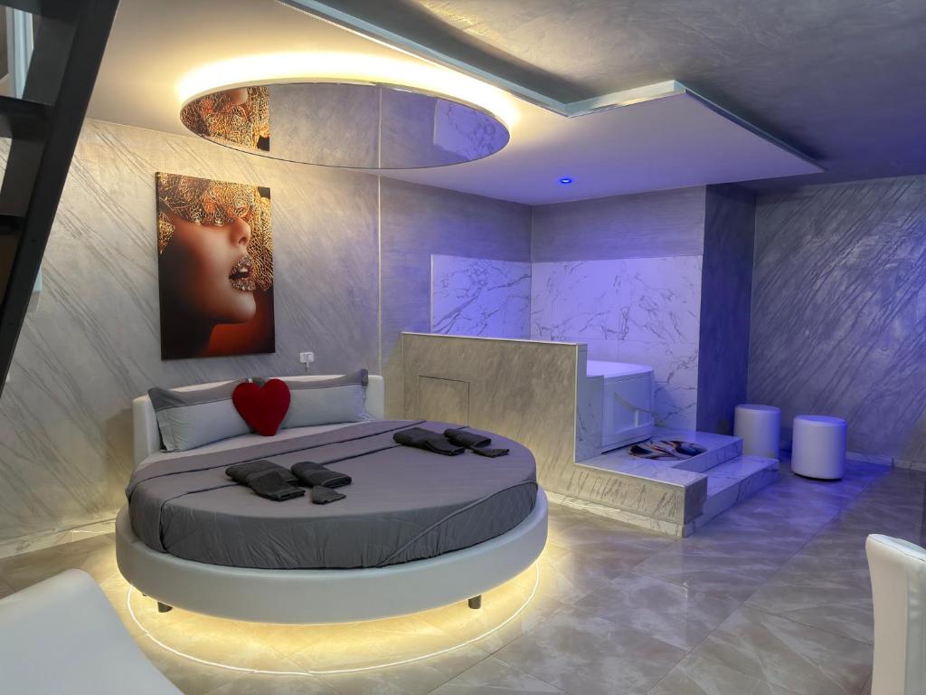 a bedroom with a bed with a heart on it at B&B Luxury Room e Spa in Apricena
