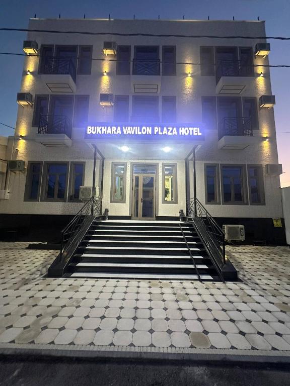 a building with a sign on the front of it at Bukhara Vavilon Plaza Hotel in Bukhara