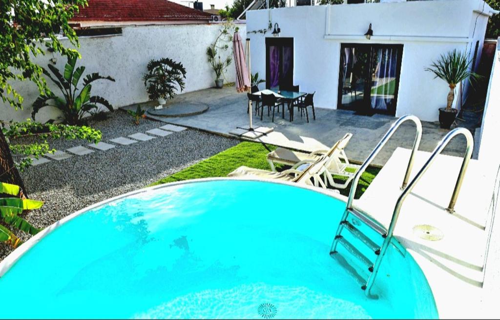 a swimming pool in the yard of a house at Heraklion Gortyn Phaistos House in Mitrópolis