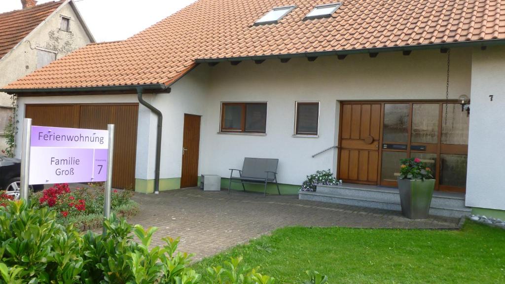 a house with a sign in front of it at Ferienwohnung Groß in Laichingen