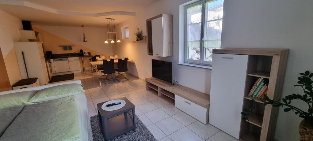 a small room with a kitchen and a living room at Ferienwohnung Frate in Velden am Wörthersee
