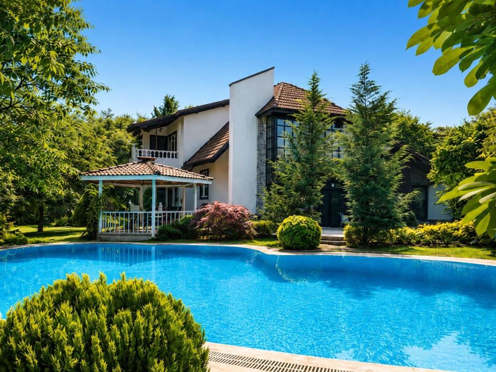 a house with a swimming pool in front of a house at Kartepe Mountain Villa in Kartepe