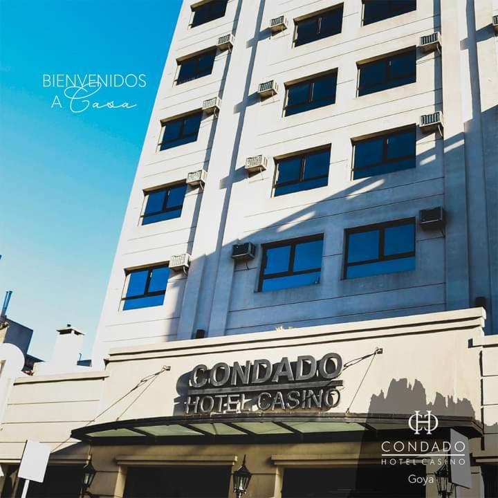 a tall white building with a sign on it at Condado Hotel Casino Goya in Goya
