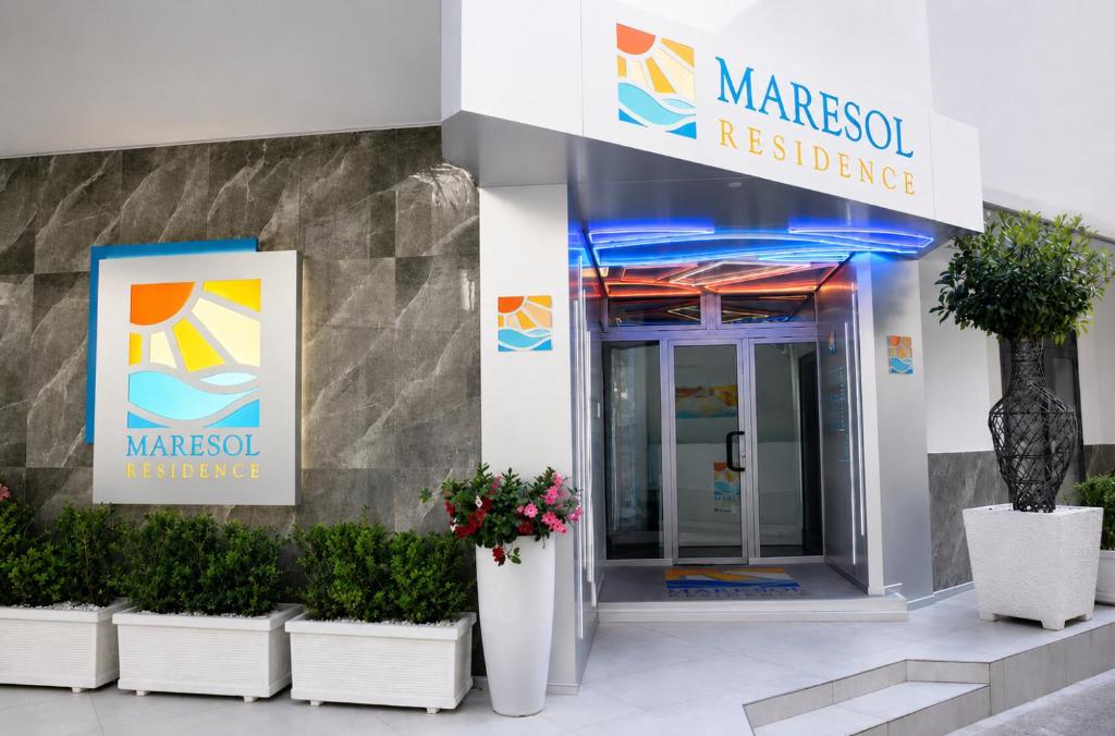 a sign for a marocsoft residence in front of a building at Maresol Residence in Bagnara Calabra