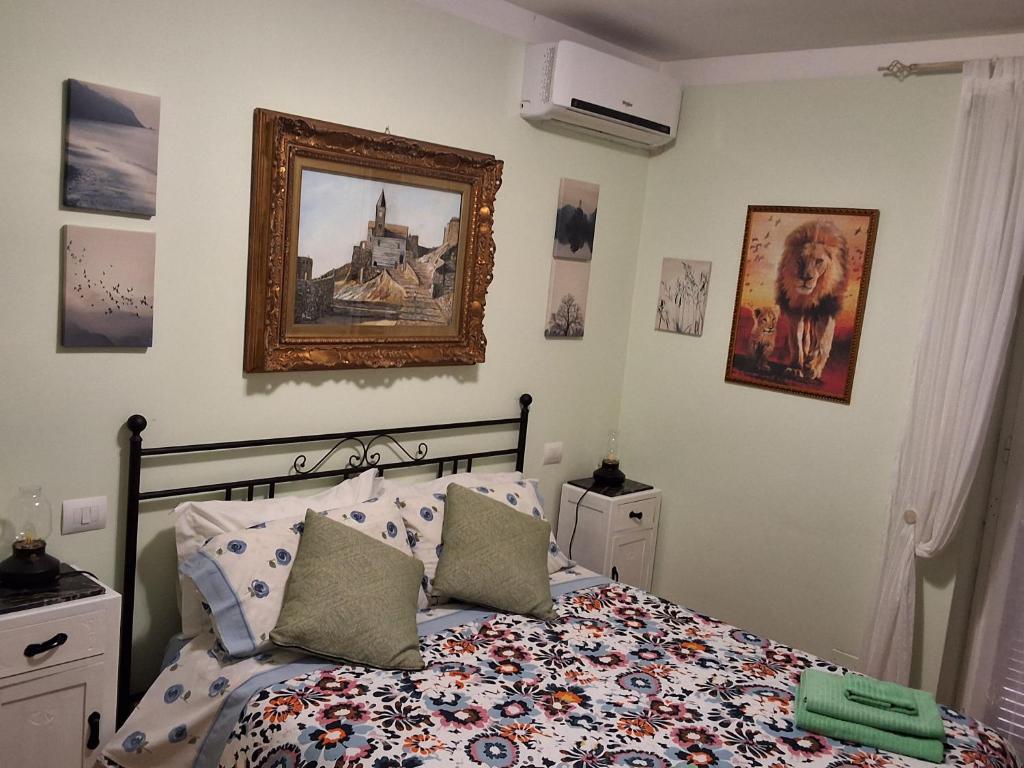 a bedroom with a bed and a picture on the wall at Imperiale in Sarzana
