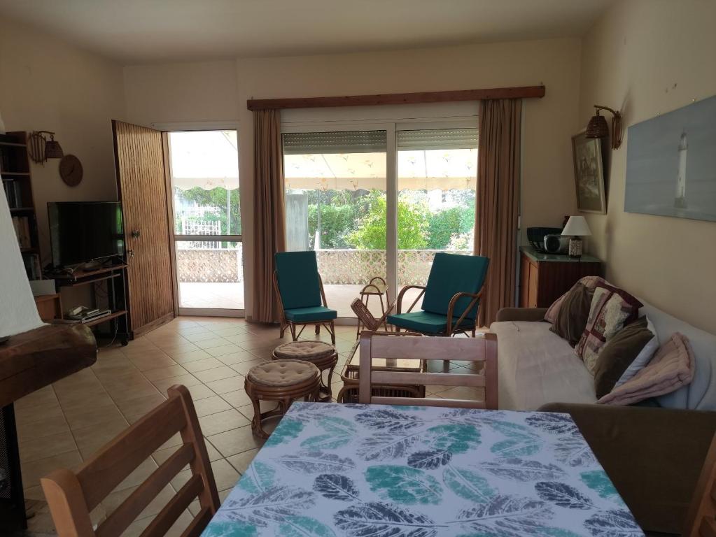 a living room with a table and chairs at Seaside villa in Eretria in Eretria