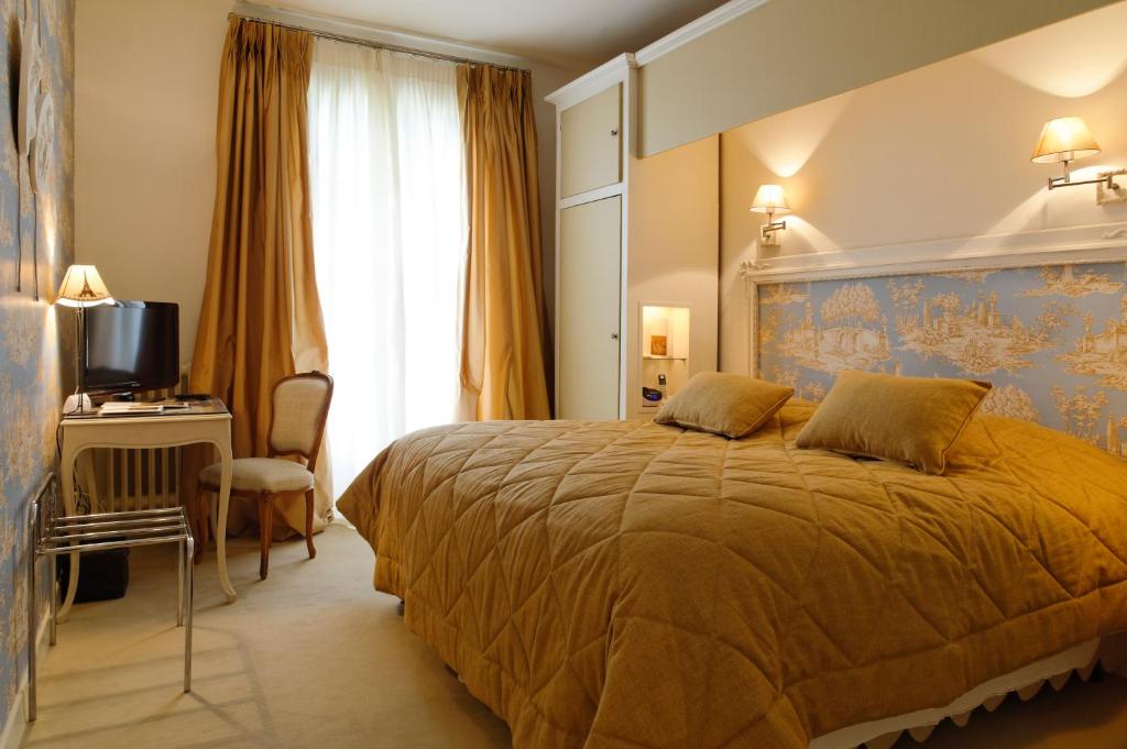 Postel nebo postele na pokoji v ubytování Domaine d'Auriac - Relais & Châteaux