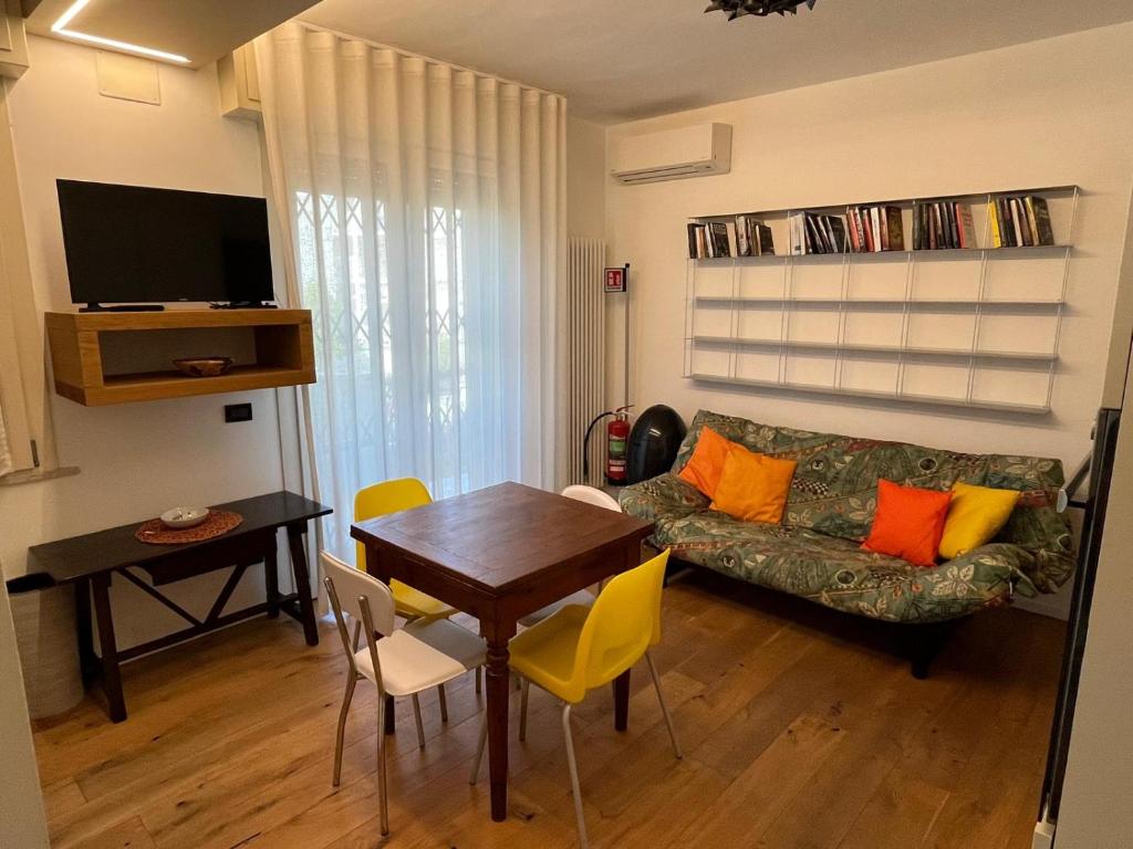 a living room with a couch and a table at Rifugio a due passi dal mare in Rimini