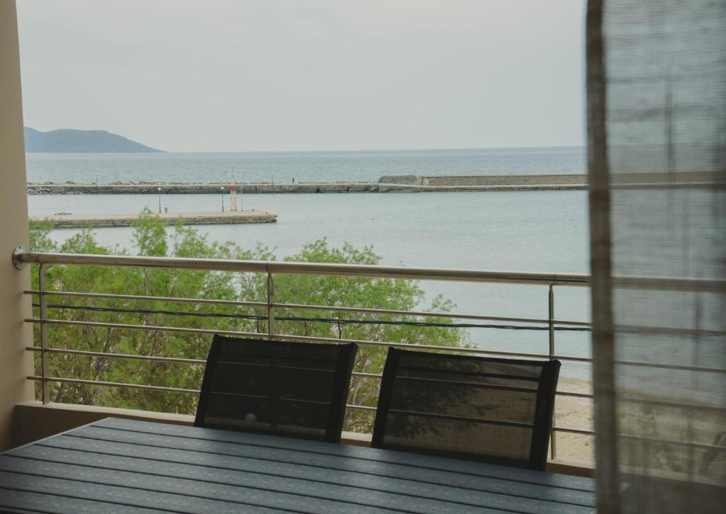a view of the ocean from a balcony at Almy Sea Apartment in Karistos