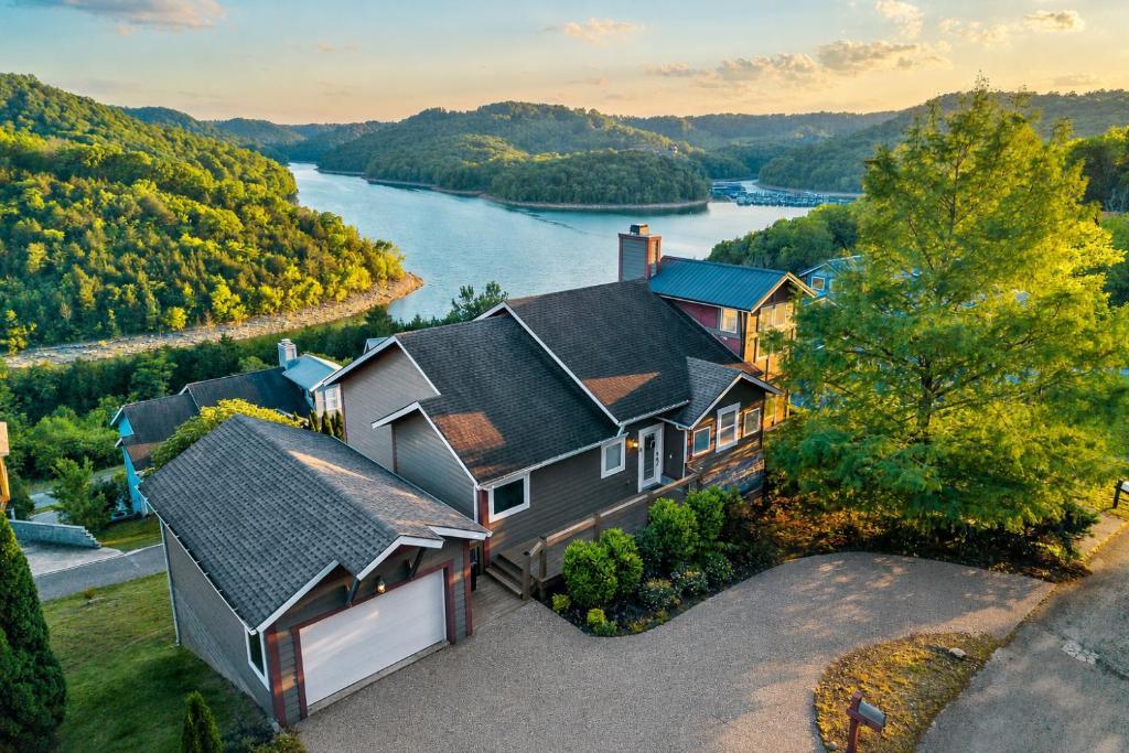an aerial view of a house with a river at Captain's Quarters in Smithville