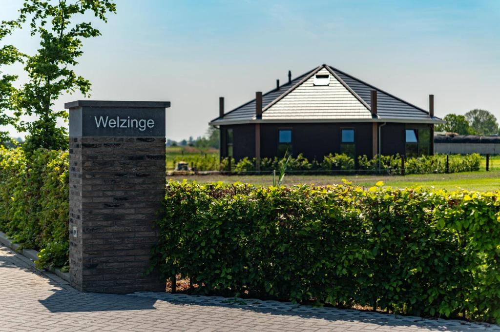 a welcome sign in front of a building at De Hooiberg in Ritthem