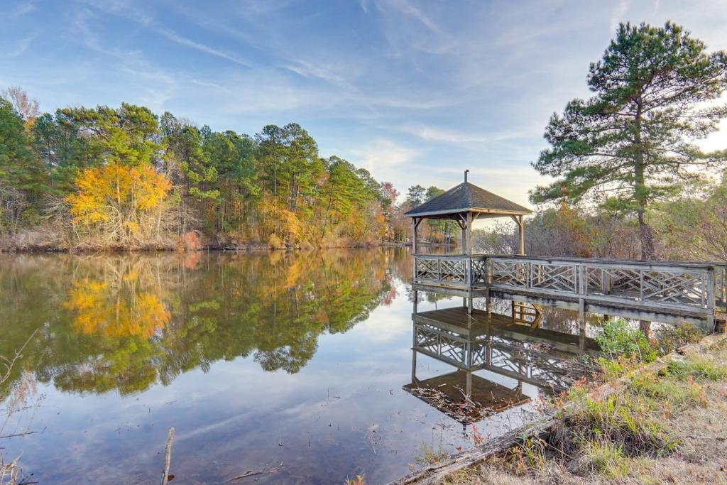 a gazebo sitting on the side of a lake at Spacious Lakefront in Fayetteville