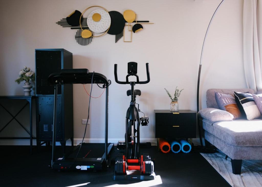 a living room with a robot in front of a couch at 3BR Modern Apt • Gym • Workspace • Quiet Location in Chicago