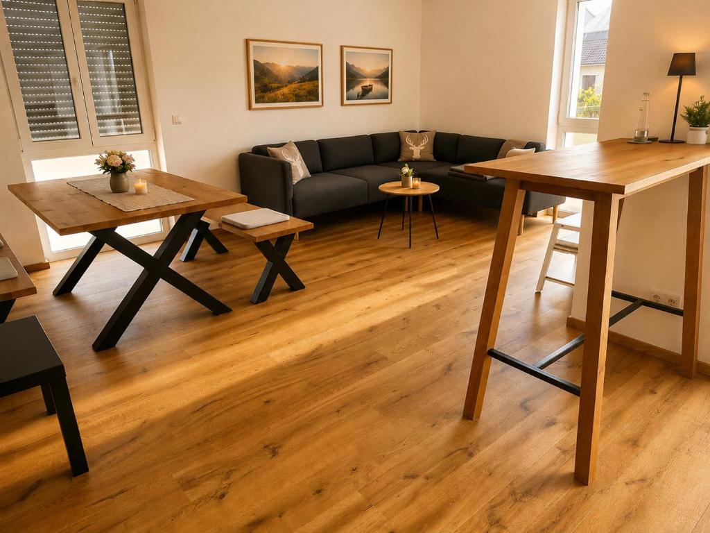 a living room with a couch and a table at Schongau Suites Premium Apartments M in Schongau