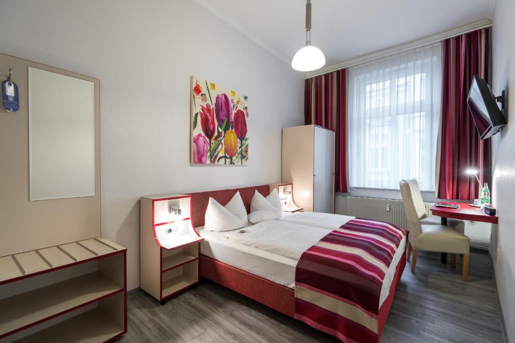 Postel nebo postele na pokoji v ubytování Hotel Stadtkrug