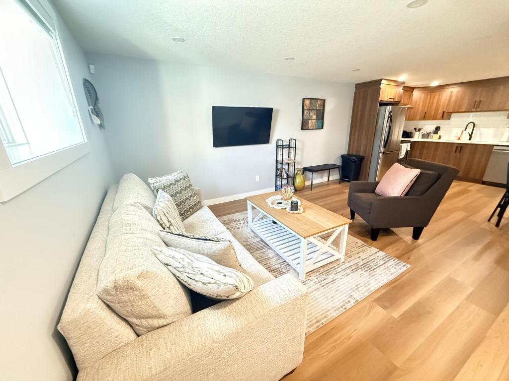 a living room with a couch and a table at 2 bedroom Cozy Secondary-Basement suite in Calgary