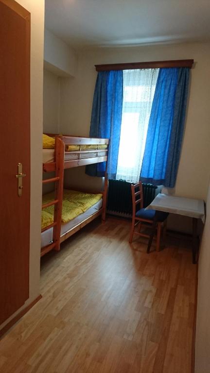 Postel nebo postele na pokoji v ubytování Stanglwirt Frühstückspension