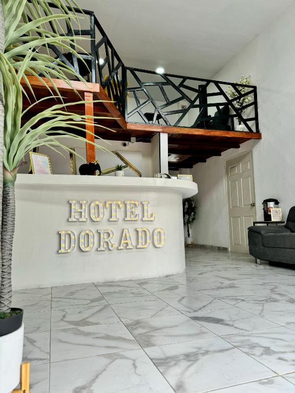 a hotel depot sign in the middle of a lobby at Hotel DORADO in Tapachula