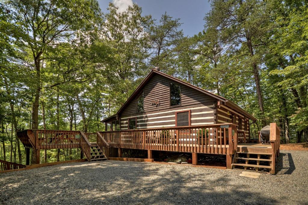 a large log cabin with a porch and a gate at Mountain Retreat in Morganton