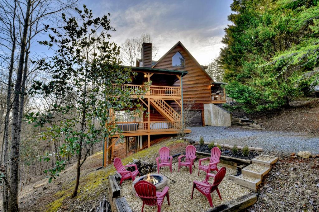 a group of pink chairs and a house at Oh Deer in Morganton
