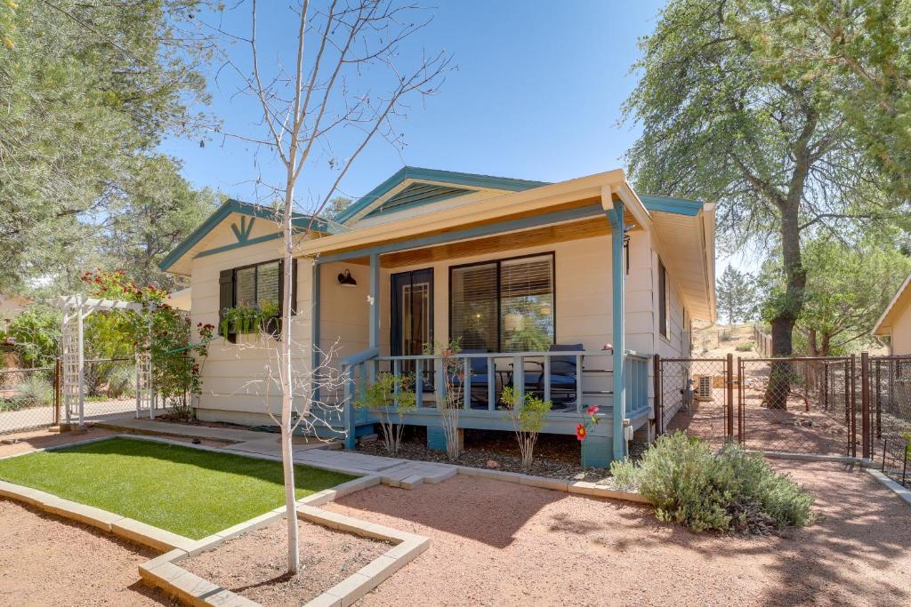 a small yellow house with a fence in a yard at Payson Summer Getaway w/ Backyard in Payson