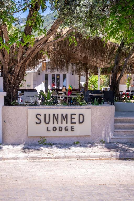 a sign for a summer lodged lodge at Sunmed Lodge in Oludeniz