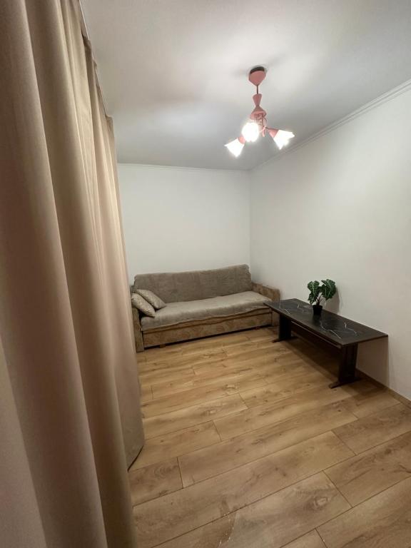 a living room with a couch and a table at Horodotska Street in Lviv