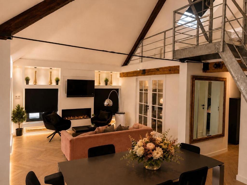 a living room with a couch and a table at Penthouse city & cathedral View for 4 in Antwerp