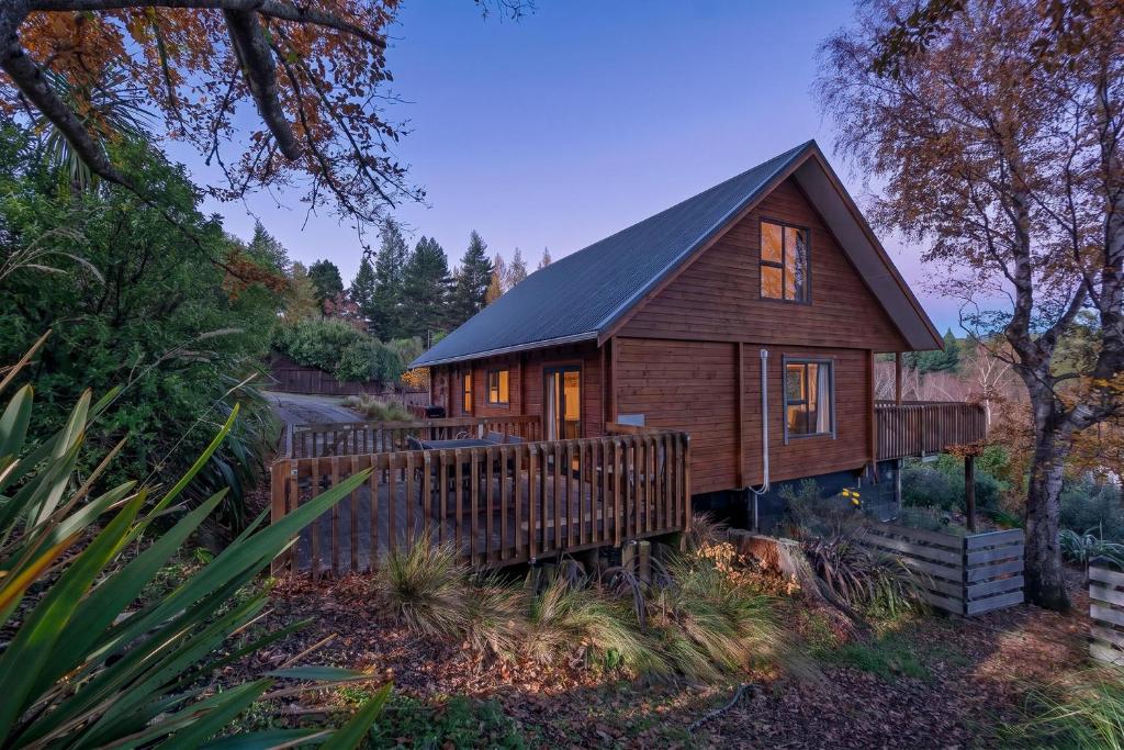 a wooden house with a fence in front of it at 19 Torquay Terrace in Hanmer Springs