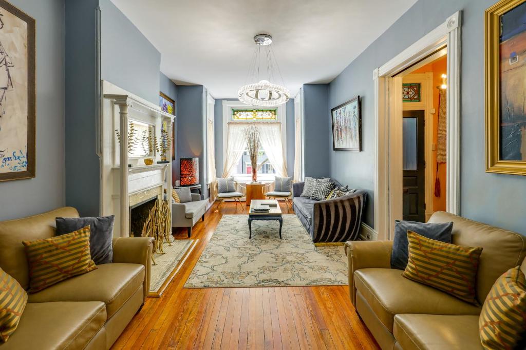 a living room with two couches and a fireplace at Historic Georgetown Townhome: Walkable Location! in Washington, D.C.