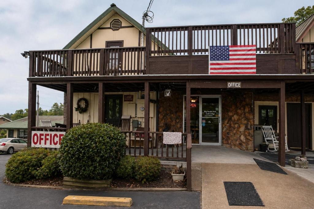 a house with an american flag on top of it at Big South Fork Trail Lodge Stearns in Stearns