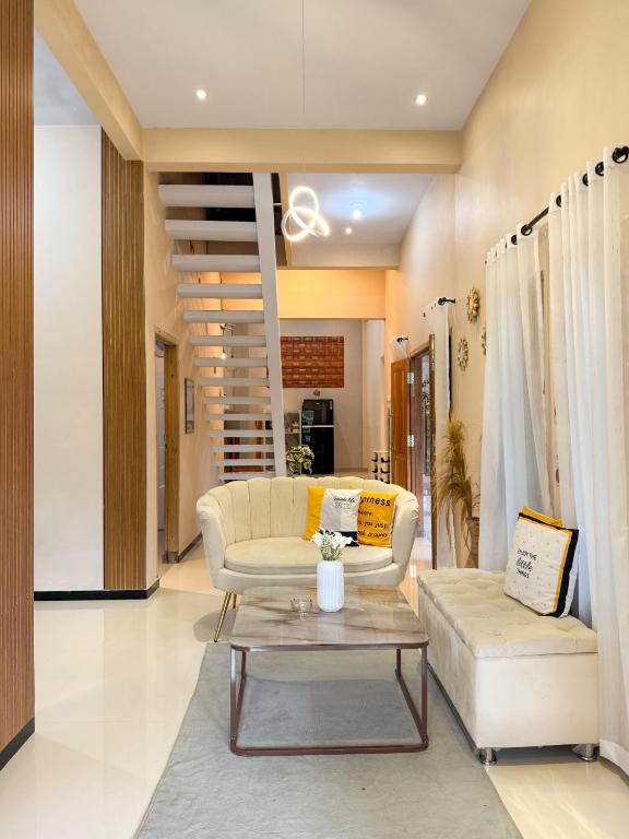 a living room with a couch and a table at Tafufu Villa Tumpak Sewu in Sumberbopong