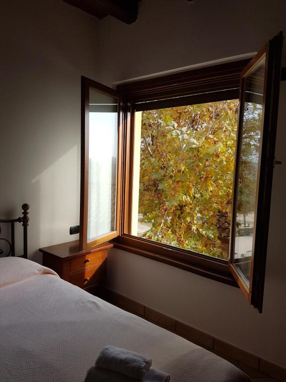 Postel nebo postele na pokoji v ubytování Agriturismo la Cavallina