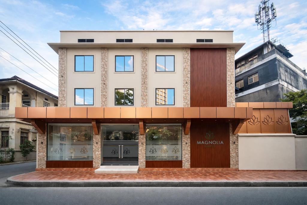 a building on the side of a street at Magnolia Suites B&B in Dar es Salaam