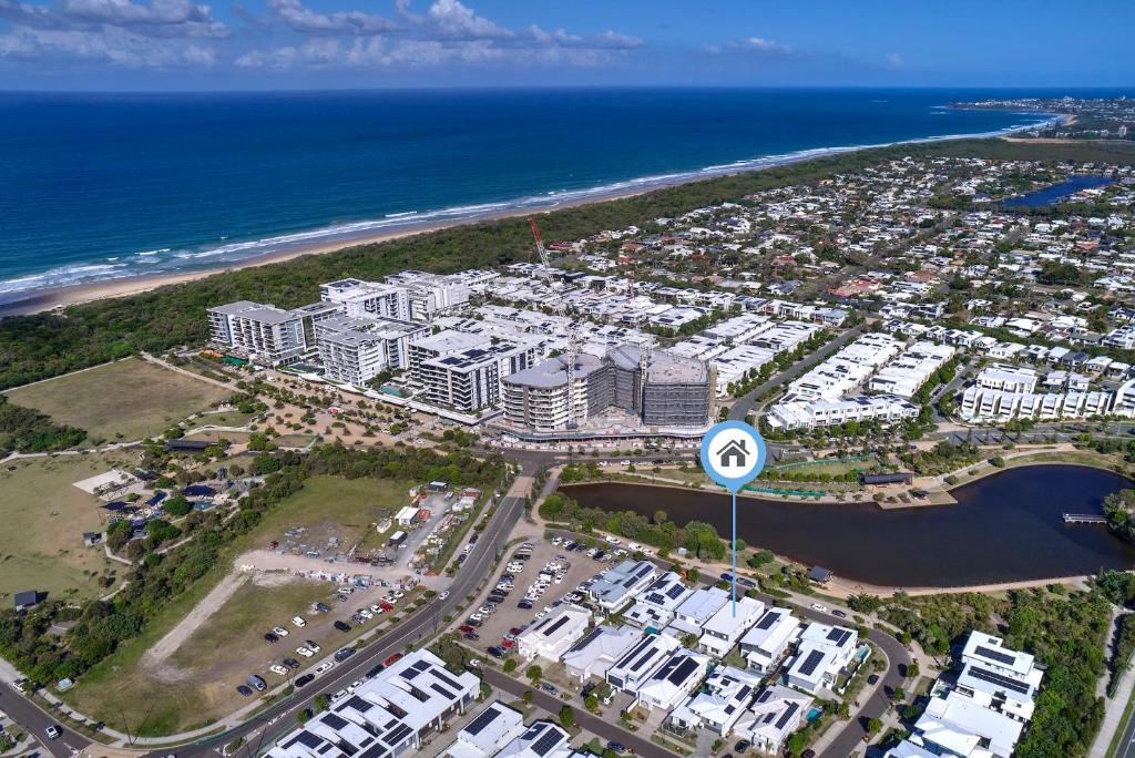 an aerial view of a resort near the ocean at Sunshine Coast Escape | Beachside, Pool & Views in Kawana Waters