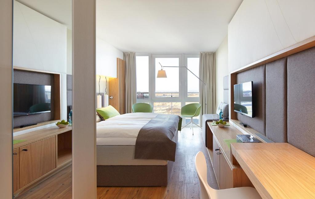 TV a/nebo společenská místnost v ubytování Strandgut Resort