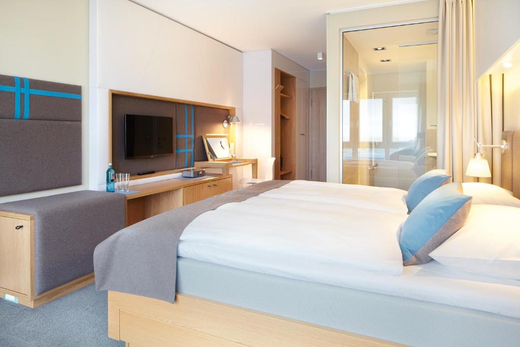 Postel nebo postele na pokoji v ubytování Strandgut Resort