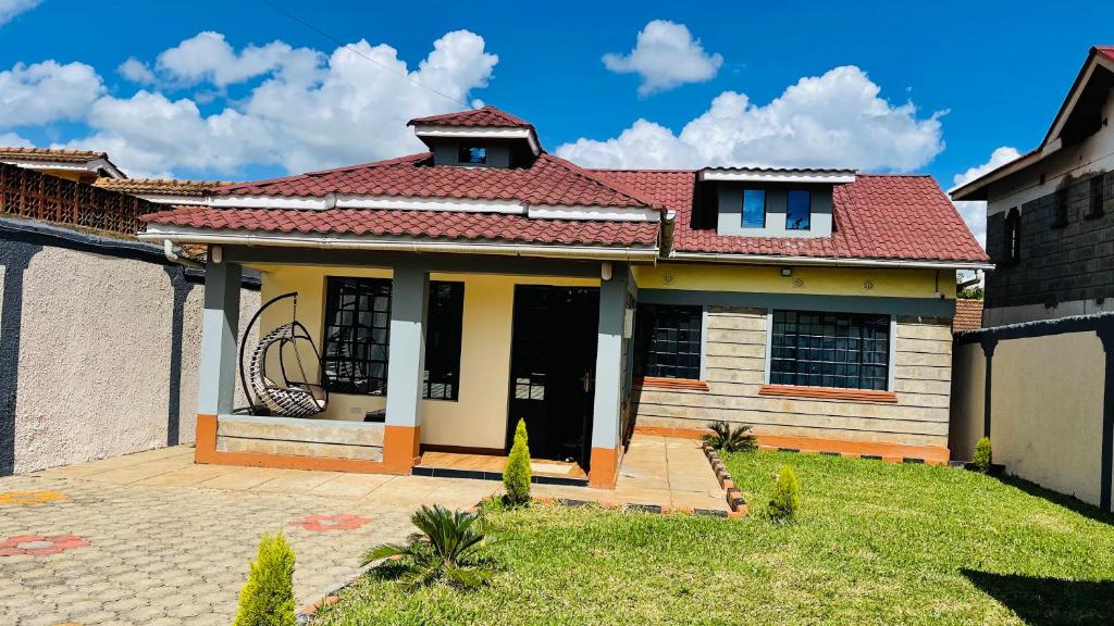 a house with a red roof at Godly Homes in Ruiru