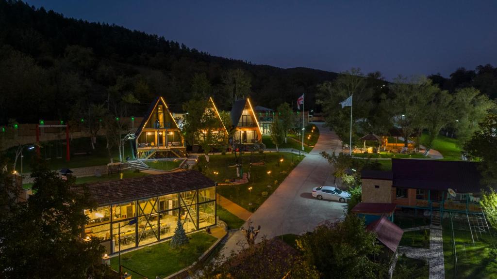 a building with christmas lights on it at night at SaguleResort in Monasteri