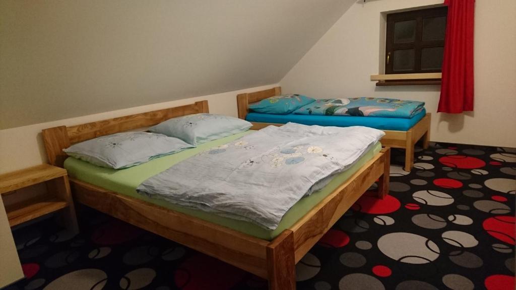 Postel nebo postele na pokoji v ubytování Penzion Krkonoše